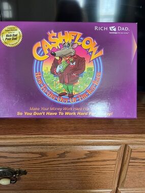 Cashflow Board Game - Purple 
Brand New. By Robert Kiyosaki
